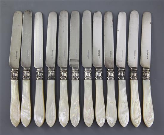 A set of twelve Victorian mother of pearl handled silver dessert knives by Aaron Hadfield,